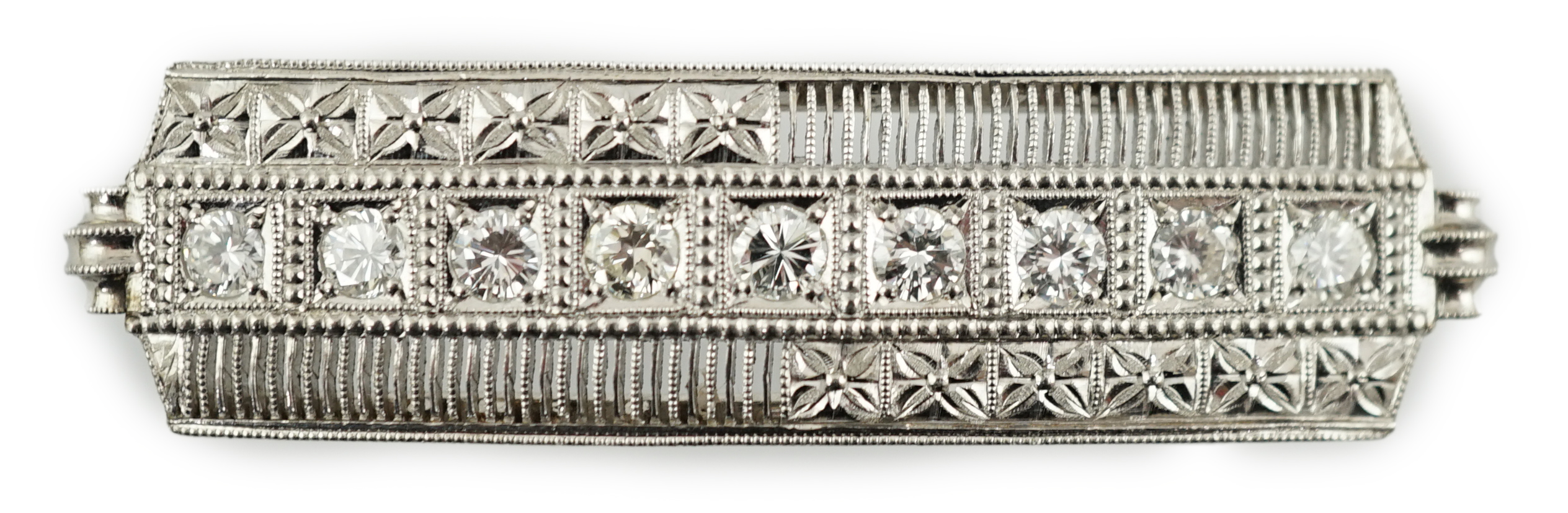 A platinum and eight stone diamond set concave clasp/attachment